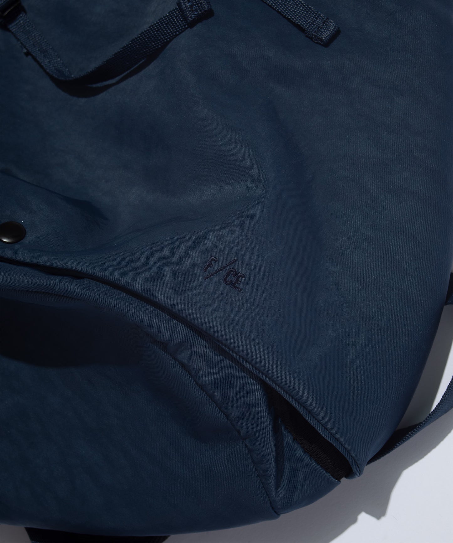 F/CE. TEXTURED TWILL 3 POINTS SLINGER BAG